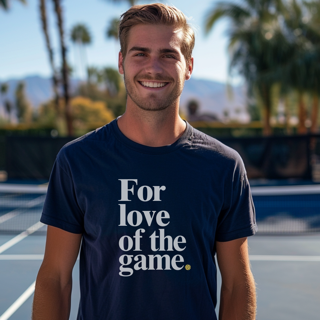 Man wearing a navy blue pickleball t-shirt that says for love of the game