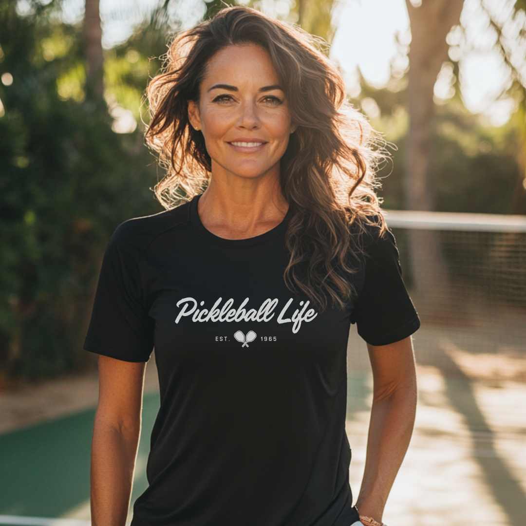 woman wearing a black Pickleball Life pickleball t-shirt