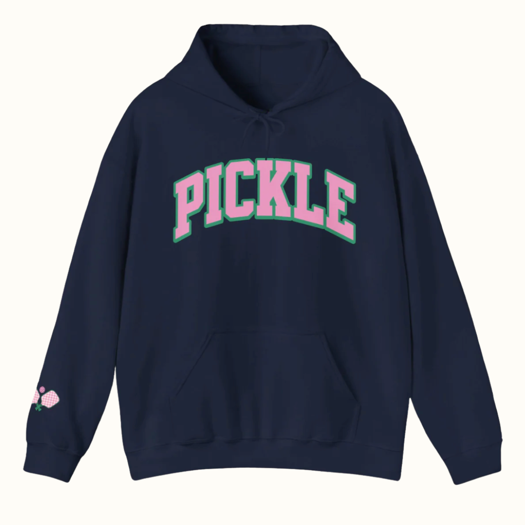 woman wearing a pink pickleball performance tee that says life's good pickleball makes it better