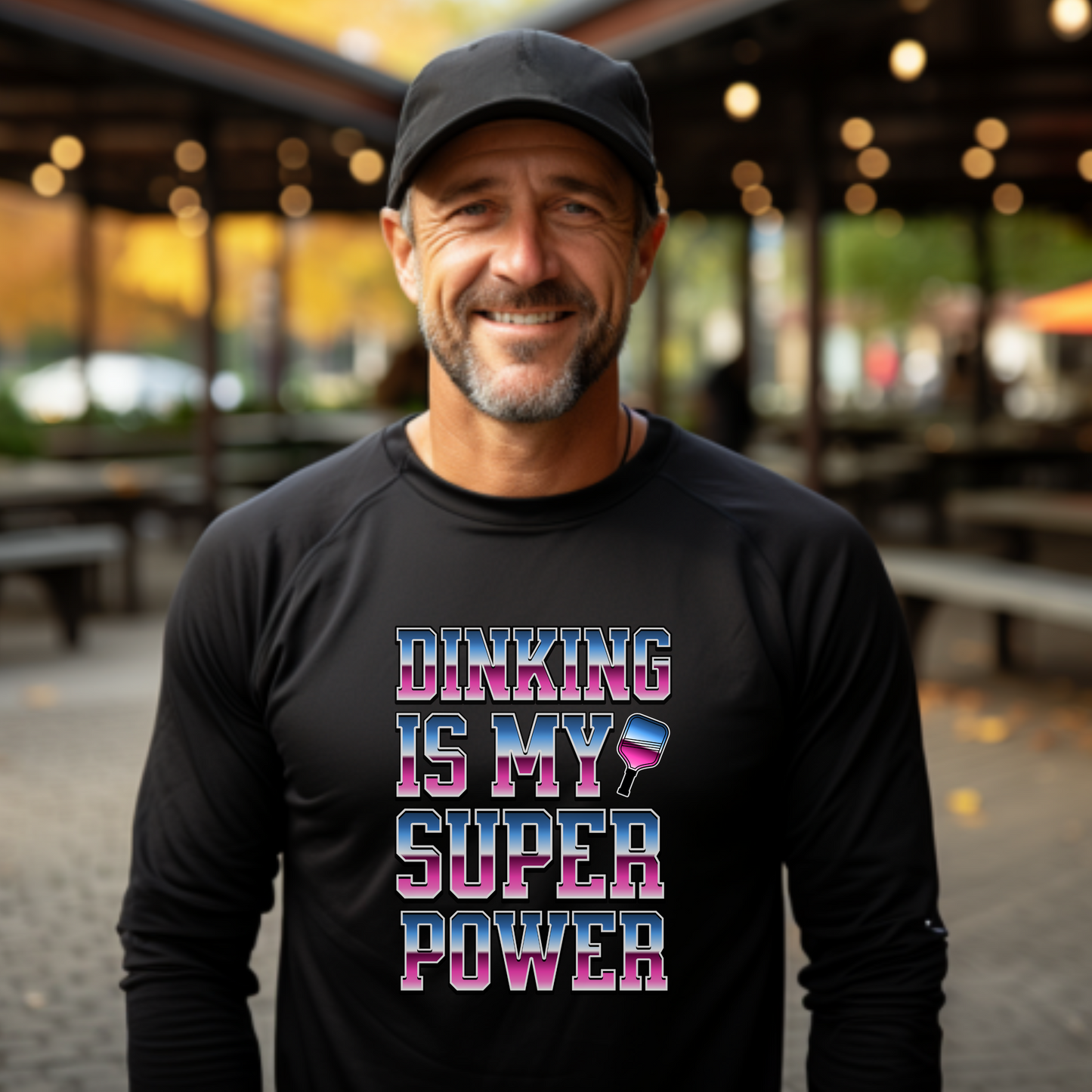 man wearing a black long sleeve pickleball t-shirt